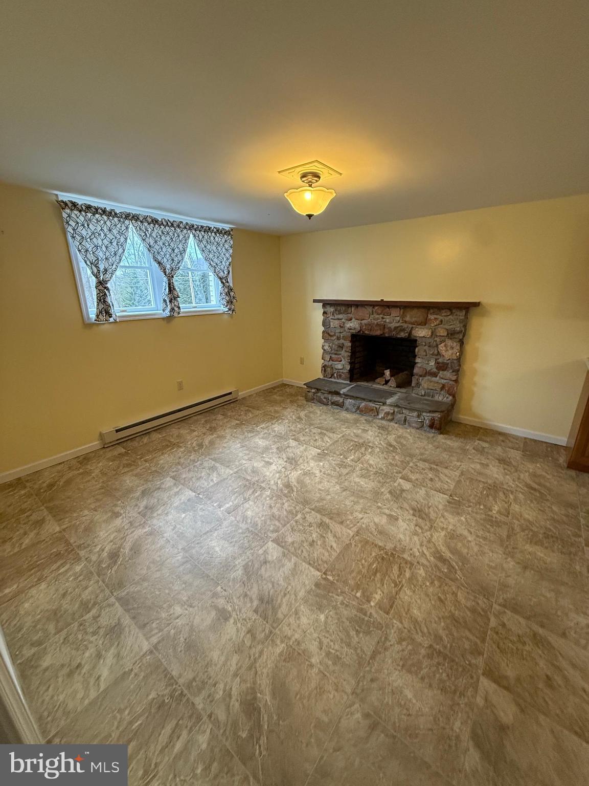 10984 Old Forge Road Waynesboro, PA 17268 - Photo 28 of 57 a view of an empty room with a fireplace