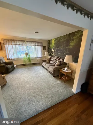 a view of a livingroom with furniture and a couch