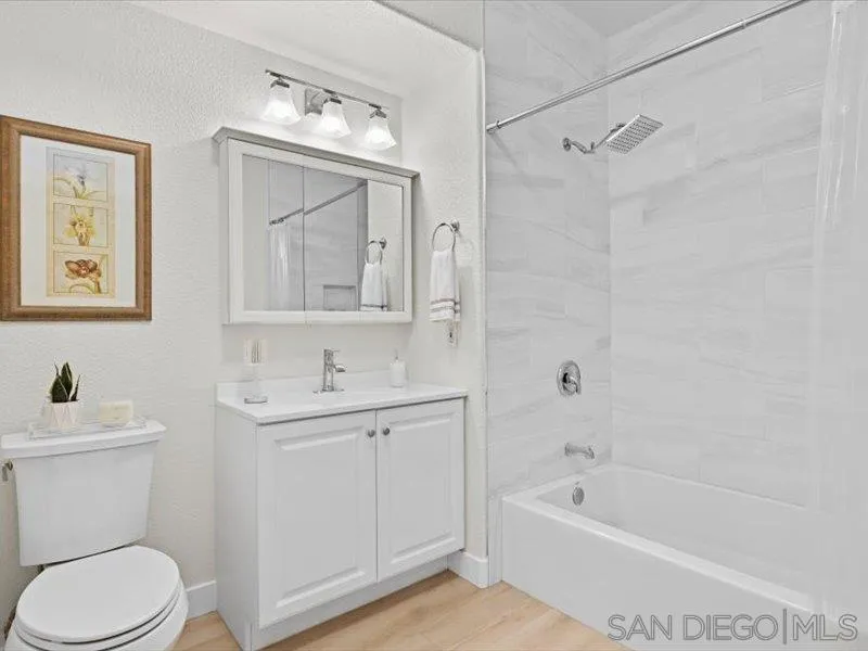 9237 Regents Road, Unit K101 La Jolla, CA 92037 - Photo 13 of 29 a bathroom with a sink a toilet and a bathtub