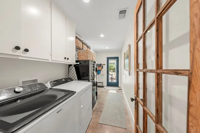a kitchen with a sink and a refrigerator