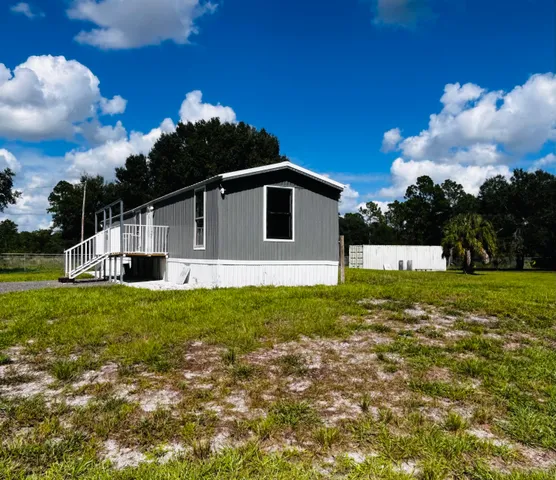 a view of a chair and table in the patio