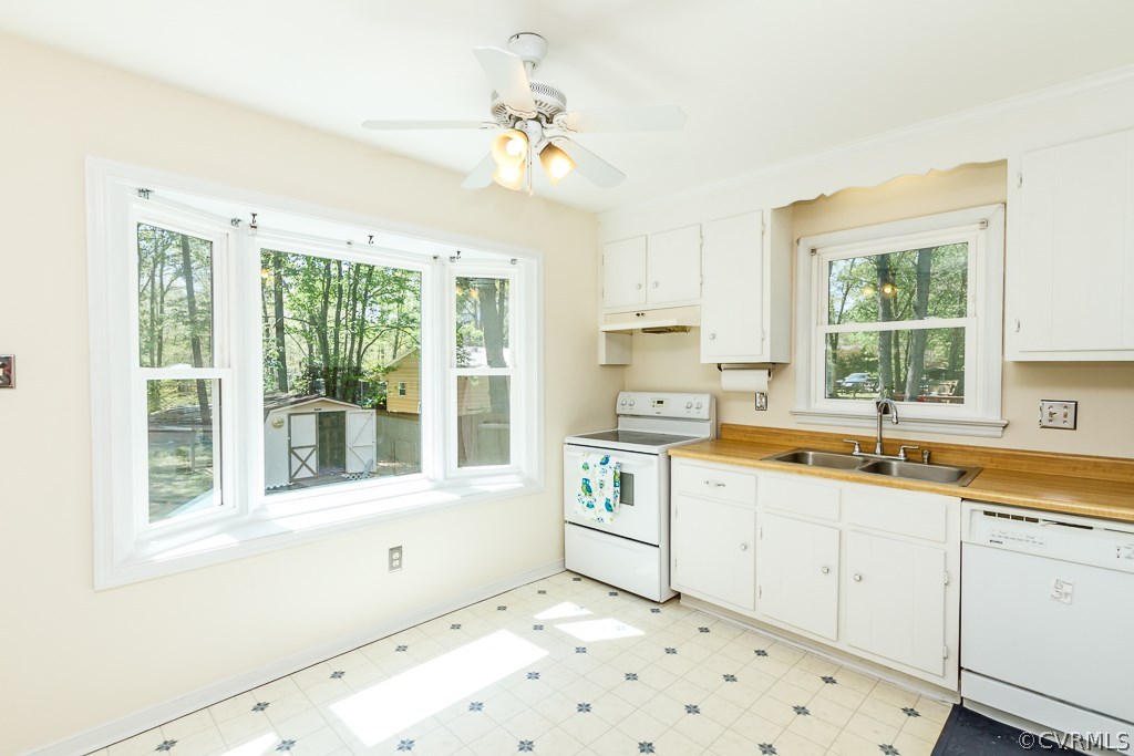 10513 Tokay Road Chesterfield, VA 23832 - Photo 8 of 24 a kitchen with a sink windows and cabinets