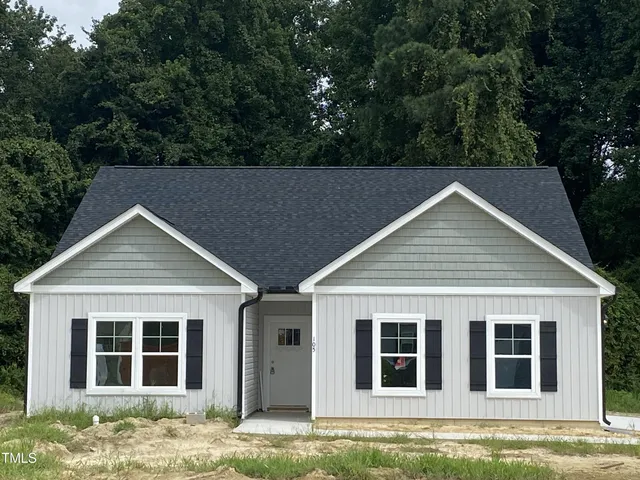 a house with trees in the background