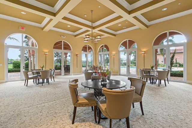a view of a dining room with furniture and chandelier