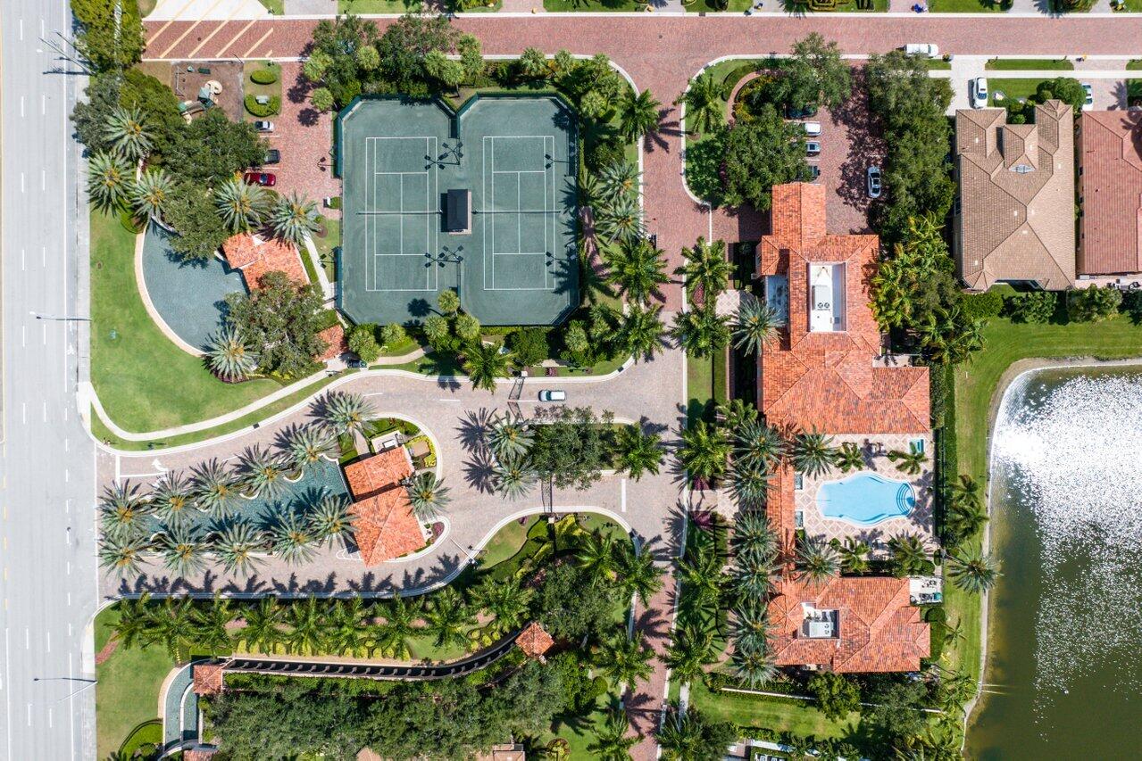 6464 Bellamalfi Street Boca Raton, FL 33496 - Photo 30 of 32 an aerial view of multiple houses with outdoor space