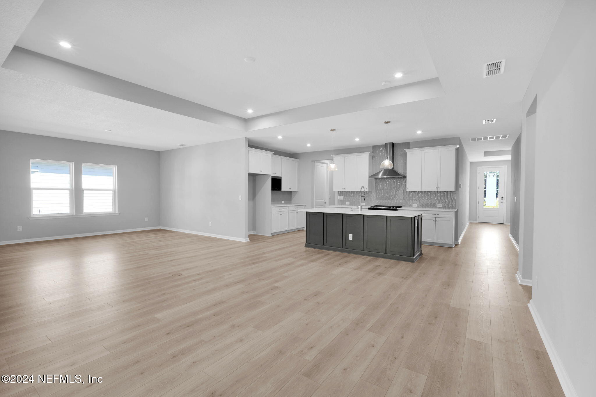 887 Goldenrod Drive St. Augustine, FL 32092 - Photo 19 of 44 a large kitchen with stainless steel appliances granite countertop a large counter top a sink and a refrigerator