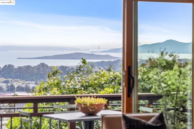 a view of a patio with table and chairs a barbeque with wooden floor and fence