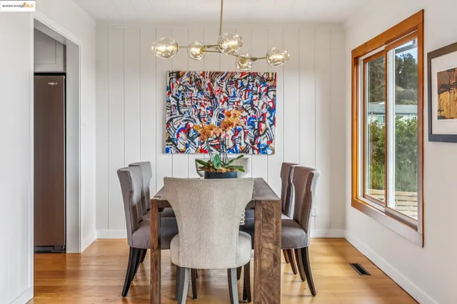 a kitchen with stainless steel appliances granite countertop a stove a refrigerator and a granite counter tops