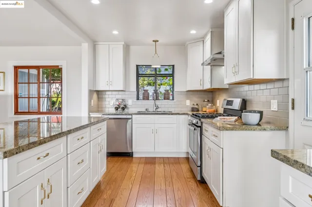 a spacious bedroom with a bed and a chandelier