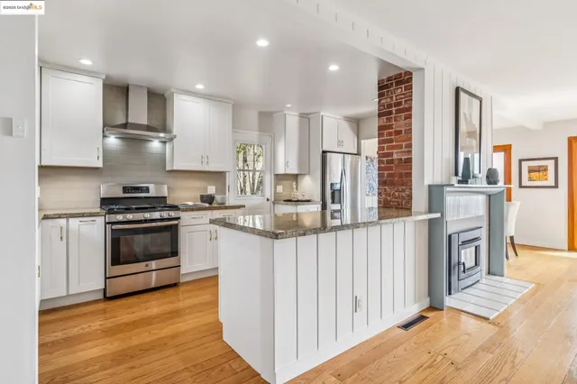 a bedroom with a bed and a lamp on dresser