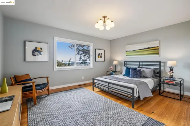 a bedroom with furniture and a window