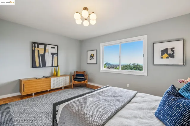 a bedroom with bed and a window