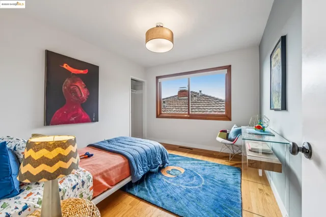 a spacious bathroom with a granite countertop sink a mirror and a shower