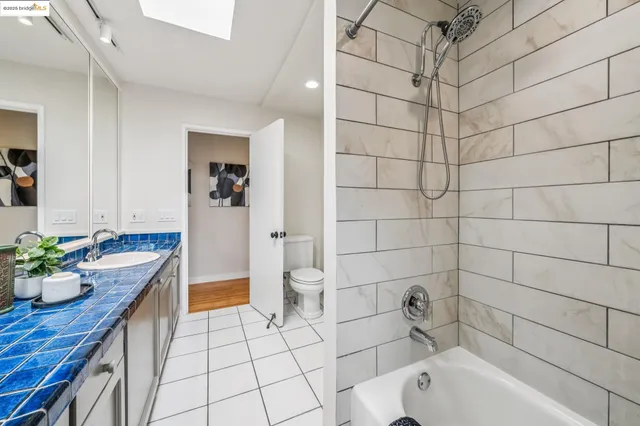 a bedroom with bed and a window