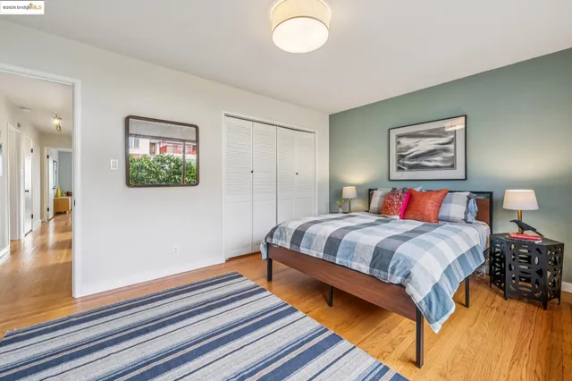 a bedroom with a bed lamp and window