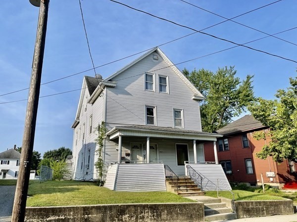 1409 Worcester Street Springfield, MA 01151 - Photo 1 of 12 a front view of a house with garden