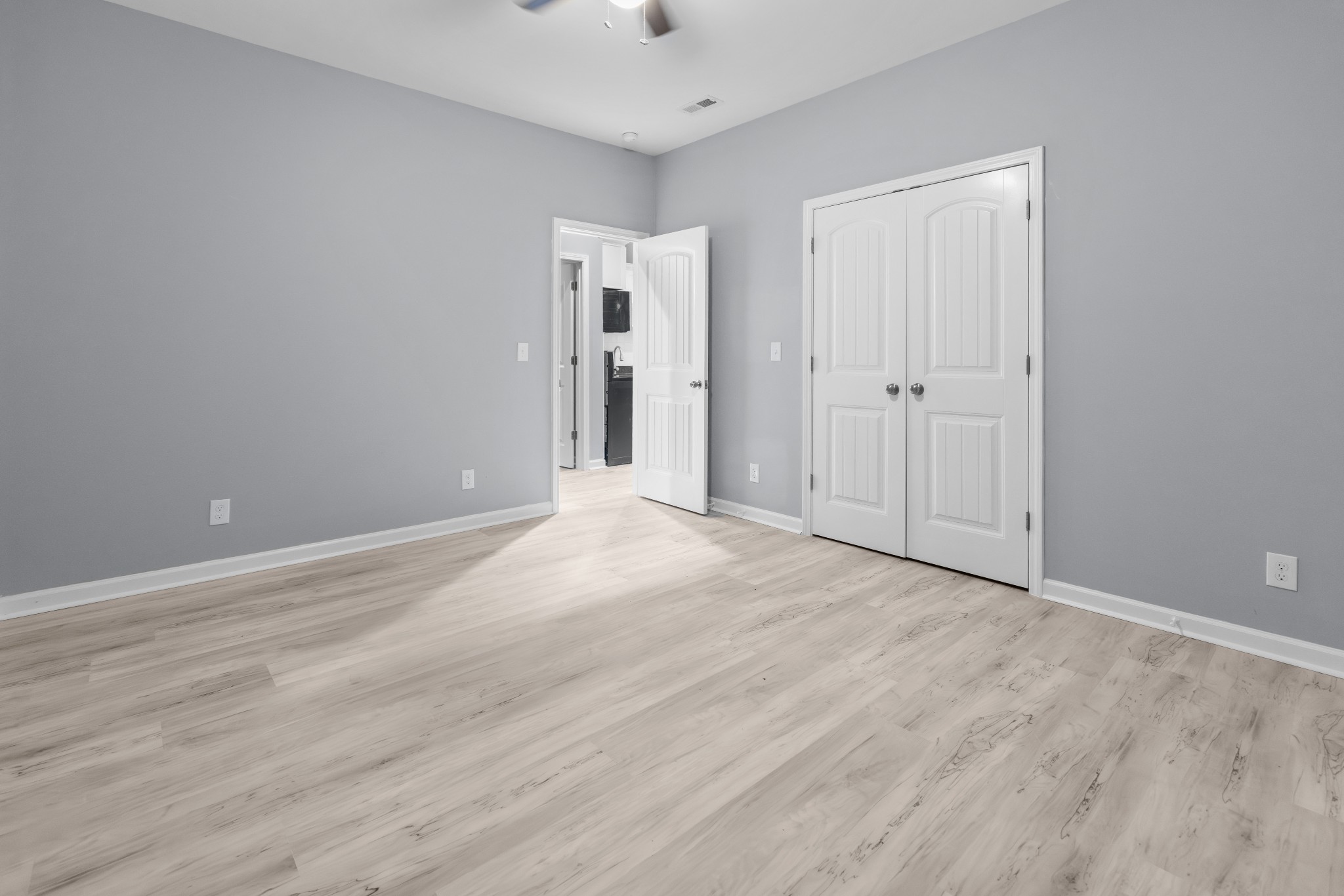 115 Freeman Street, Unit A Tullahoma, TN 37388 - Photo 12 of 25 a view of an empty room and wooden floor