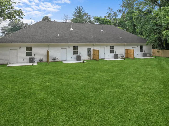 a aerial view of a house with a yard and a porch