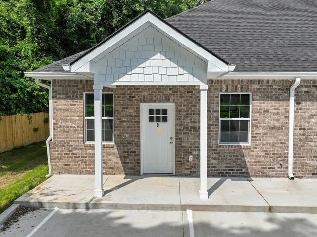 a front view of a house with garage