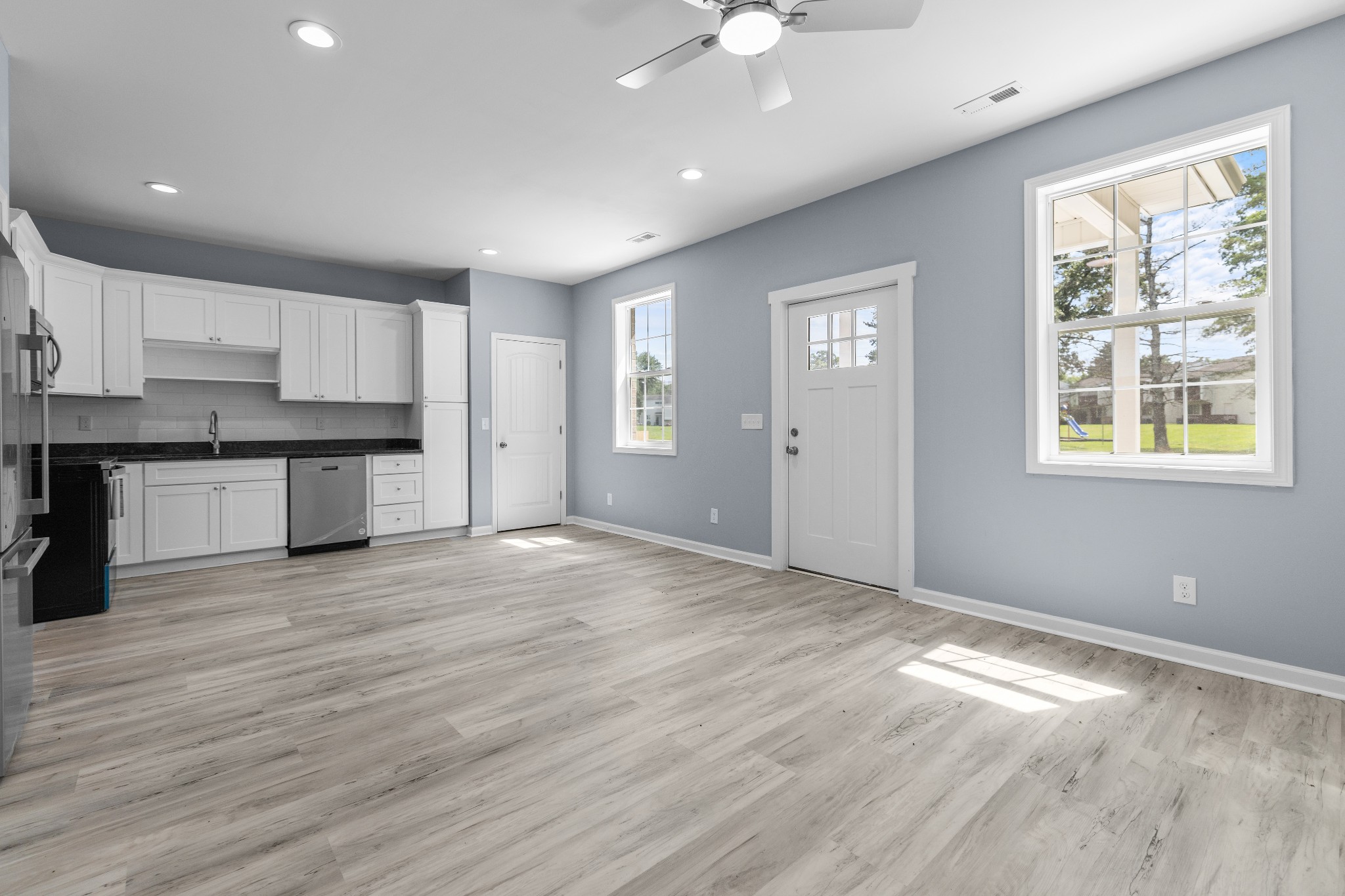 115 Freeman Street, Unit A Tullahoma, TN 37388 - Photo 7 of 25 a view of a kitchen with a dishwasher cabinets and wooden floor