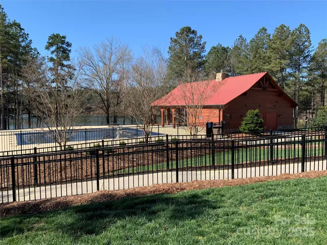 a view of a wrought iron fences in front of house