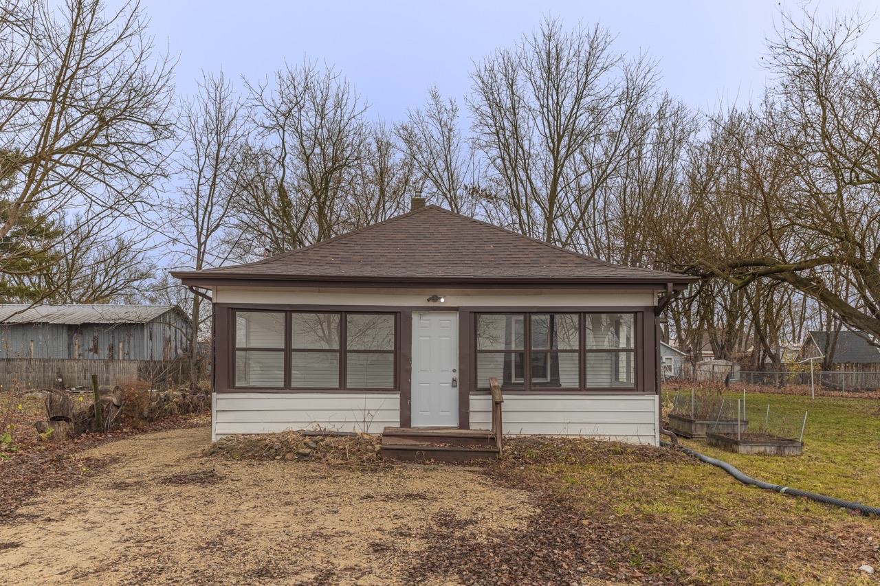 11783 Genessee Street Rockton, IL 61072 - Photo 1 of 31 a front view of a house with a yard and garage
