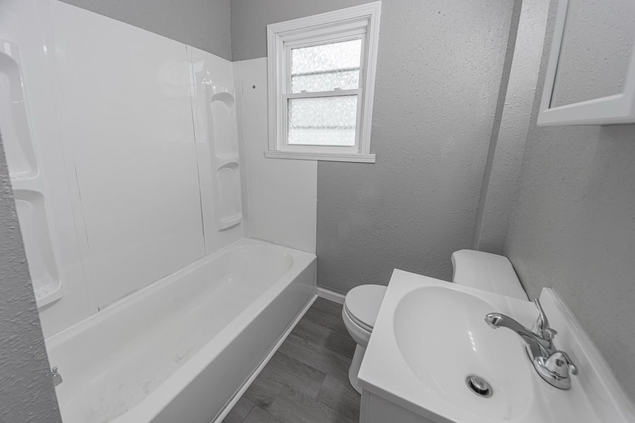 11783 Genessee Street Rockton, IL 61072 - Photo 14 of 31 a bathroom with a sink and a bathtub