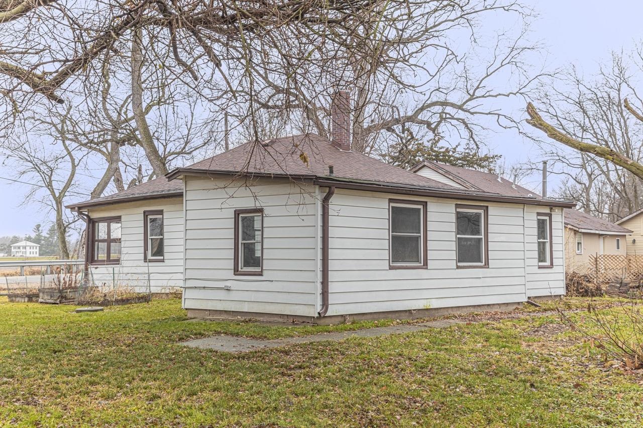 11783 Genessee Street Rockton, IL 61072 - Photo 8 of 31 a front view of a house with a garden