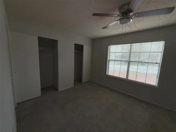 a bathroom with a shower and a toilet