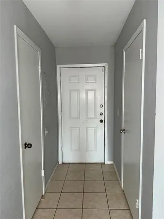 an empty room with a fireplace