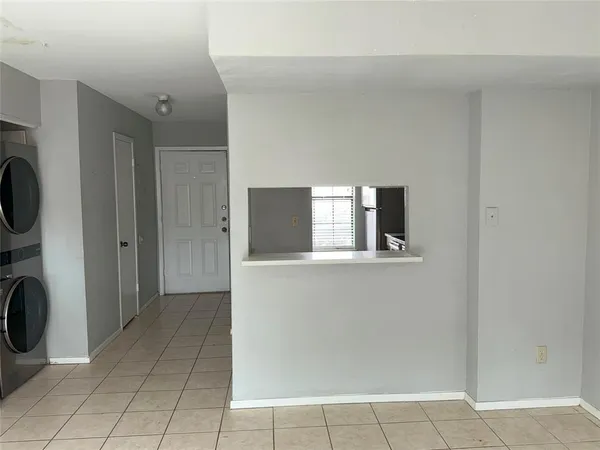 a kitchen with stainless steel appliances a sink stove and cabinets