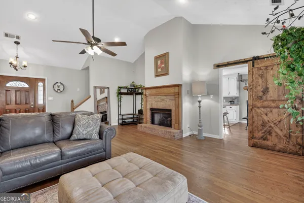 a living room with furniture and a window