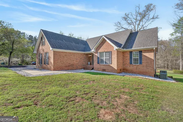a view of a dining room with furniture and a rug