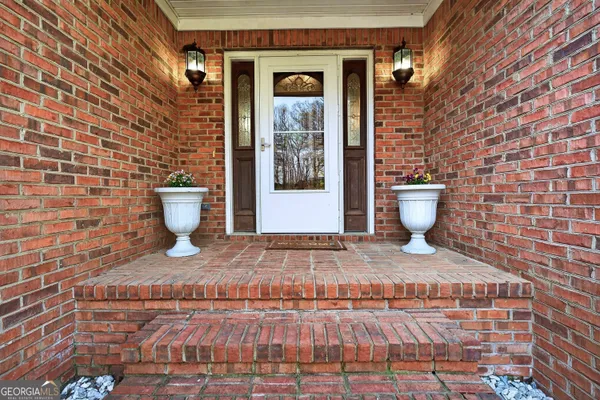 a kitchen with cabinets appliances a sink and a window