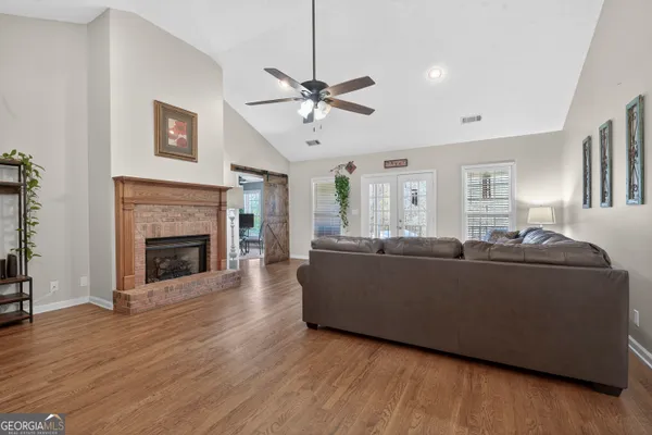 a living room with furniture and a flat screen tv