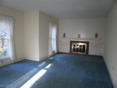 825 North Ridge Road Lorain, OH 44053 - Photo 3 of 21 Enjoy a fireside chat as you pass the winter comfortably in this spacious Living room! The fireplace is the center attraction of this room with built in cabinetry on each side.