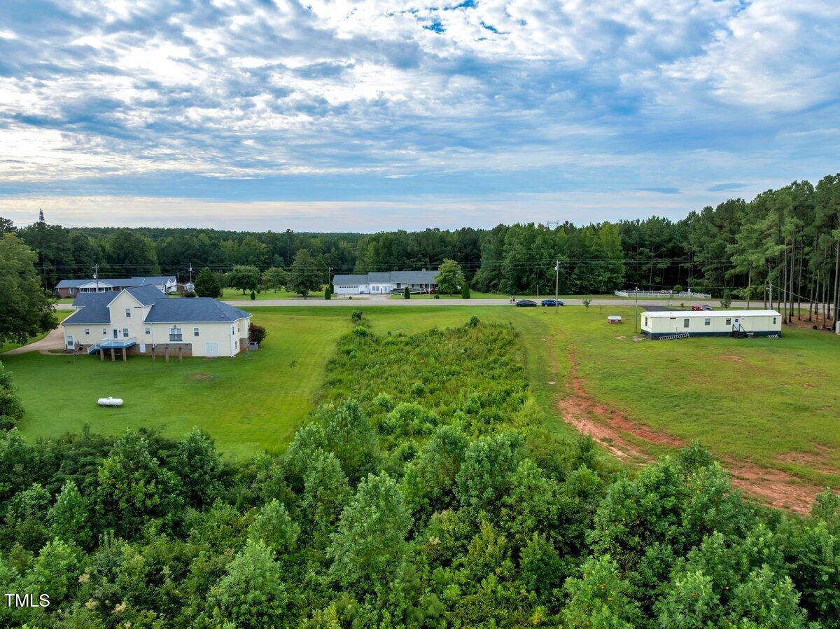 7-7a Richardson Road Warrenton, NC 27589 - Photo 2 of 12 a view of a garden with lawn chairs