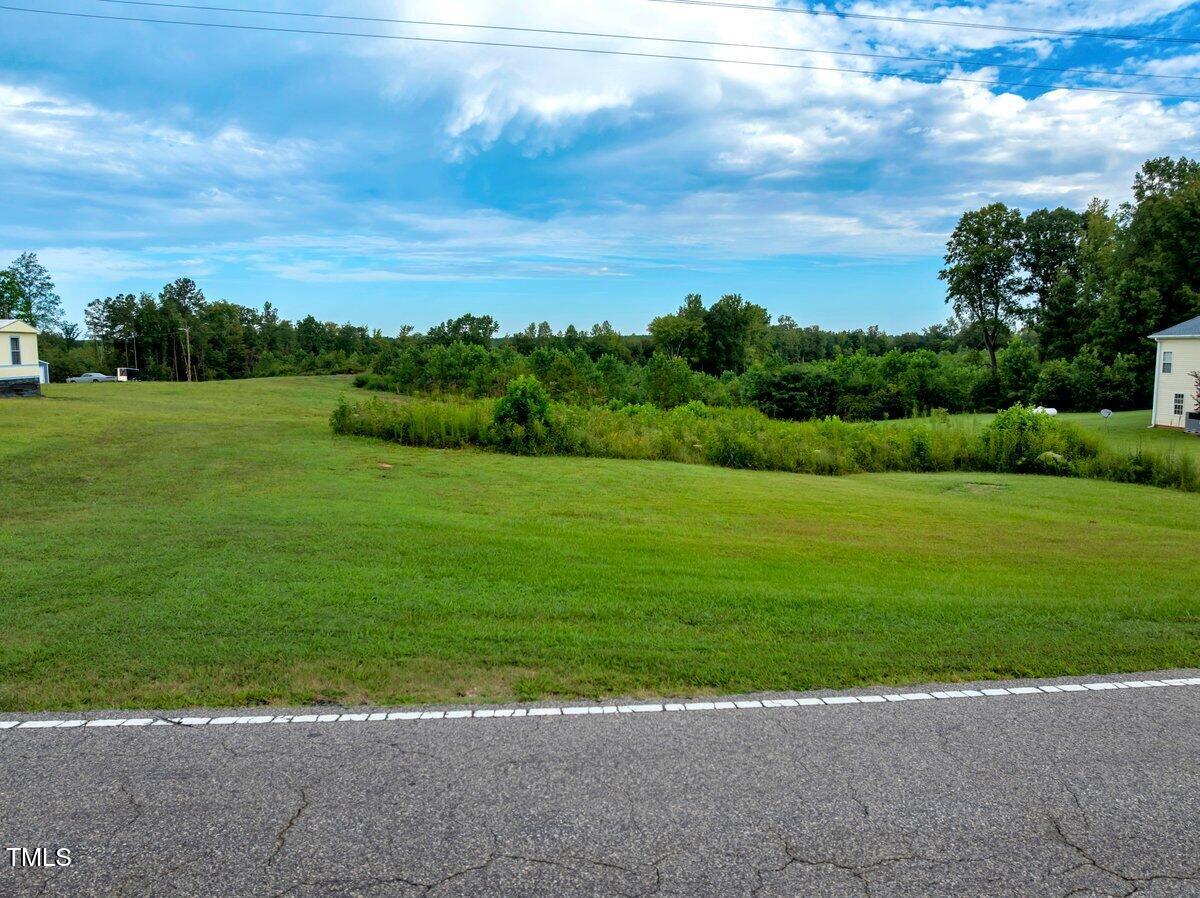 7-7a Richardson Road Warrenton, NC 27589 - Photo 3 of 12 a view of a garden with a building in the background