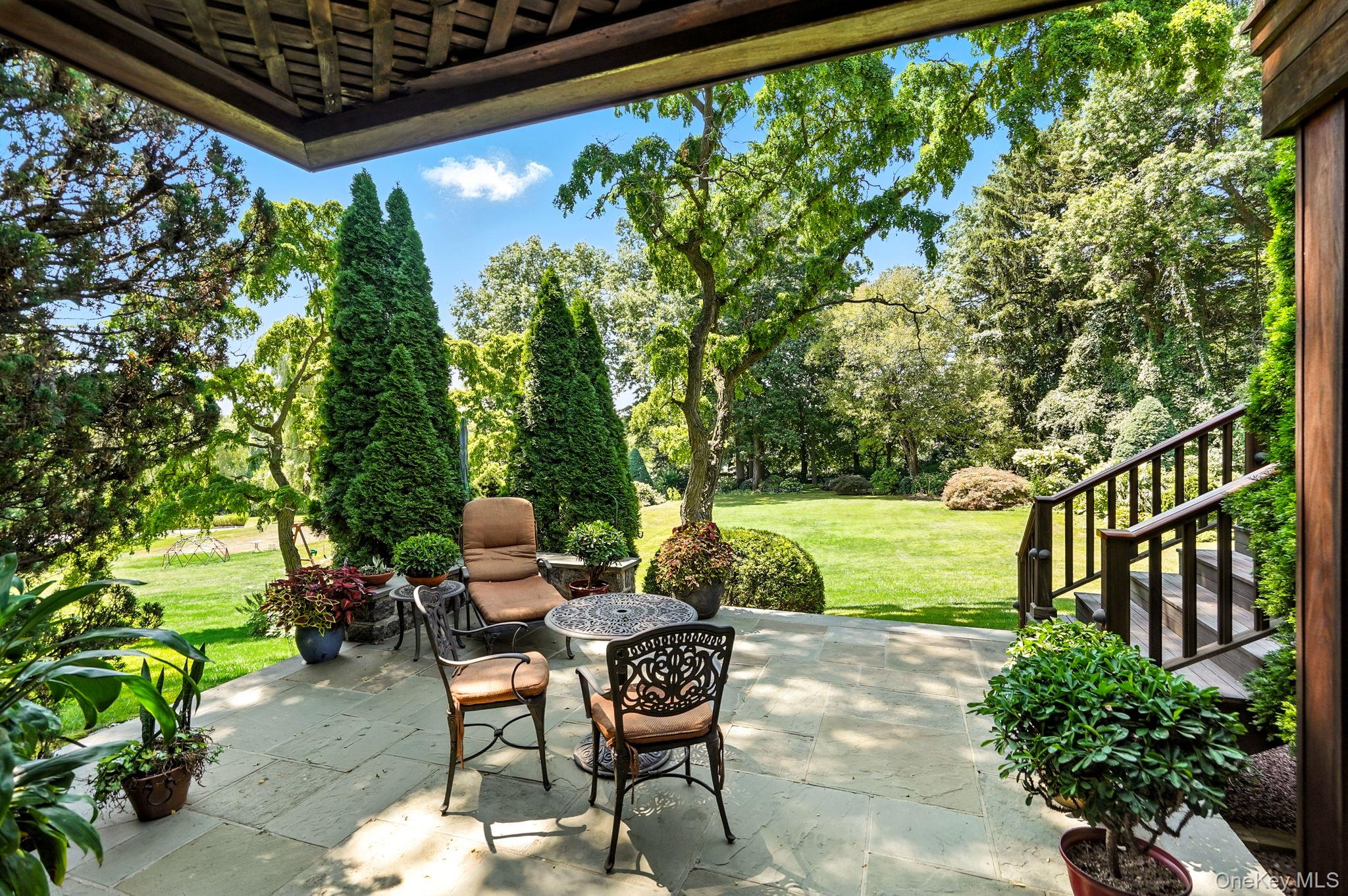 33 Hevelyne Road Elmsford, NY 10523 - Photo 40 of 43 View of patio featuring view of wooded area