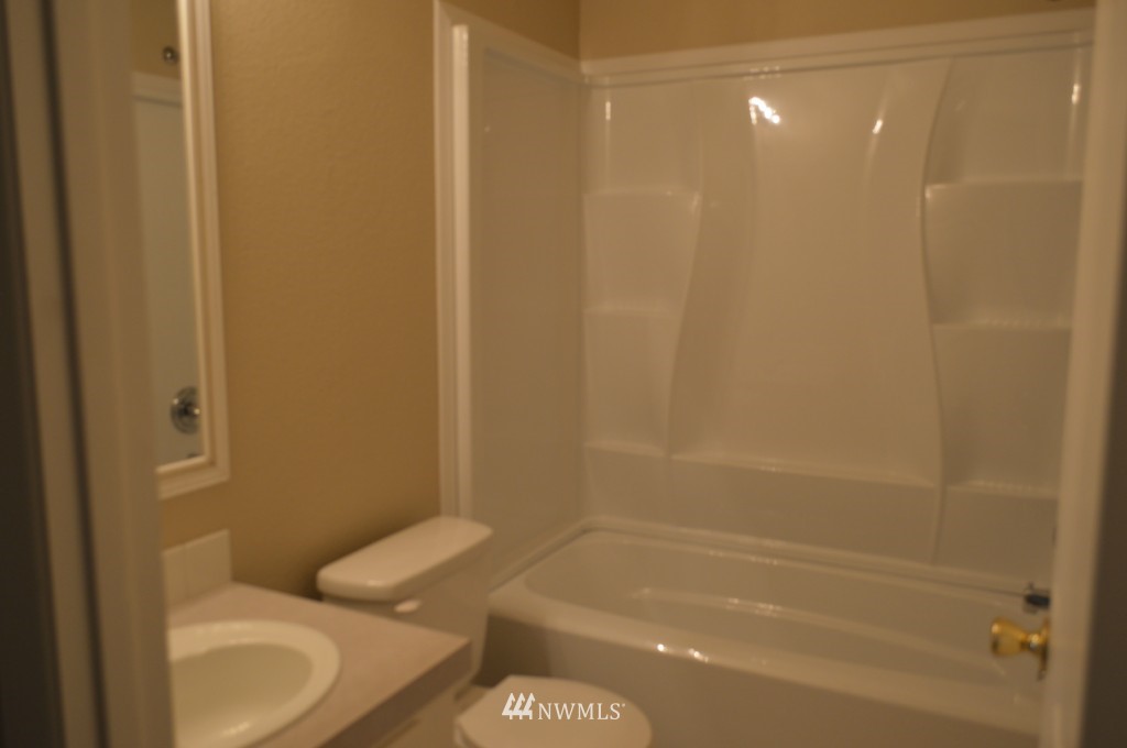 7112 187th Avenue Southwest Rochester, WA 98579 - Photo 14 of 19 a bathroom with a sink and a shower