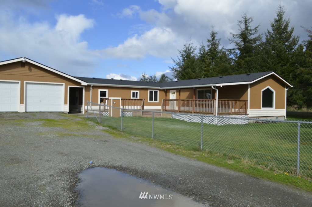 7112 187th Avenue Southwest Rochester, WA 98579 - Photo 3 of 19 a view of a house with backyard and garden