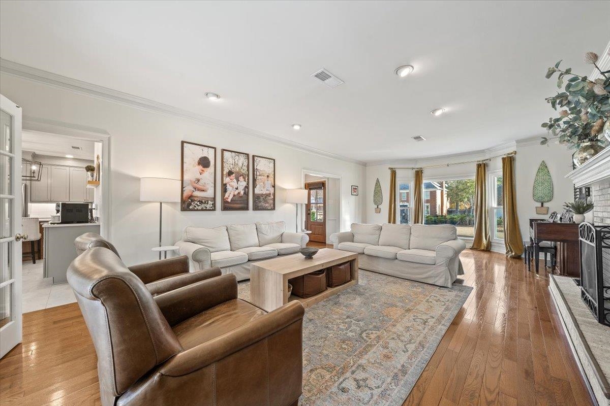 621 Fox Lair Cove Collierville, TN 38017 - Photo 11 of 37 a living room with furniture wooden floor and a table