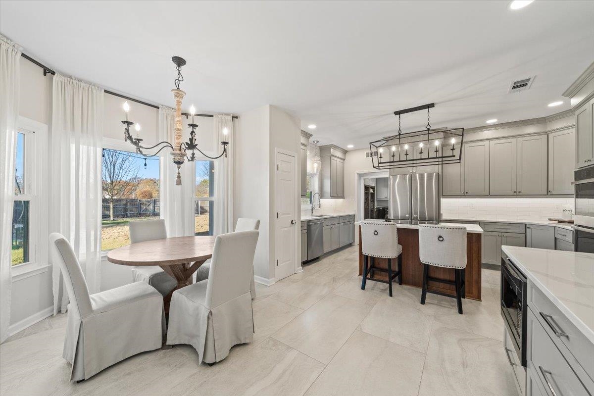 621 Fox Lair Cove Collierville, TN 38017 - Photo 18 of 37 a view of a kitchen and dining room