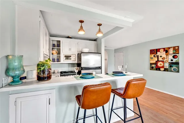 a room with gym equipment and large windows