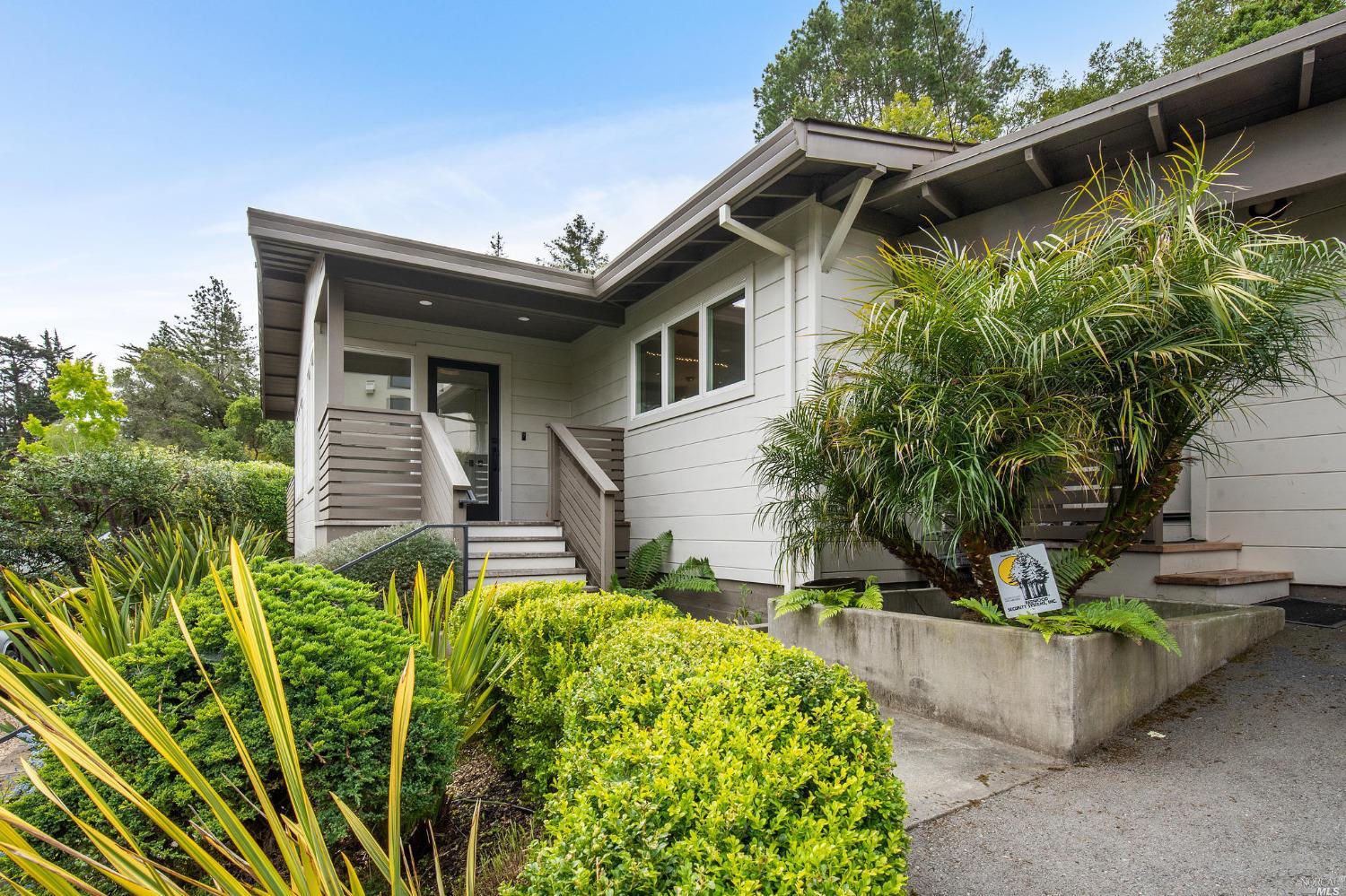 a front view of a house with garden