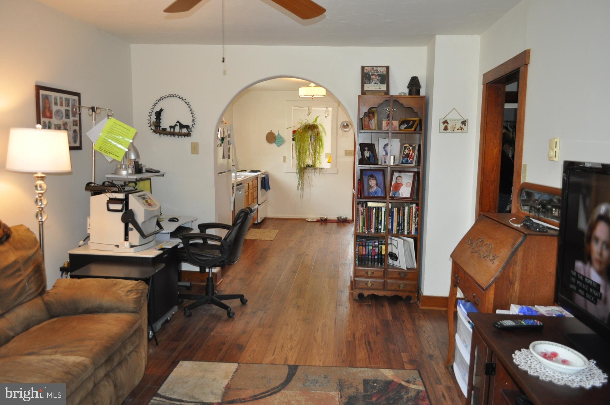 205 East 7th Avenue Ranson, WV 25438 - Photo 12 of 29 a living room with furniture and wooden floor