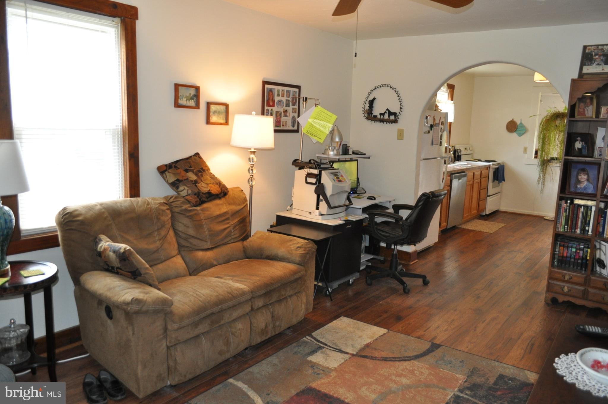 205 East 7th Avenue Ranson, WV 25438 - Photo 14 of 29 a living room with furniture and wooden floor