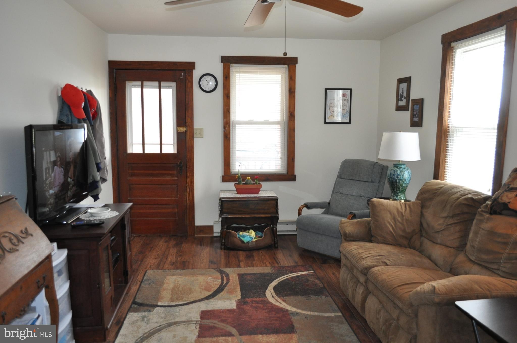 205 East 7th Avenue Ranson, WV 25438 - Photo 15 of 29 a living room with furniture window and a fireplace