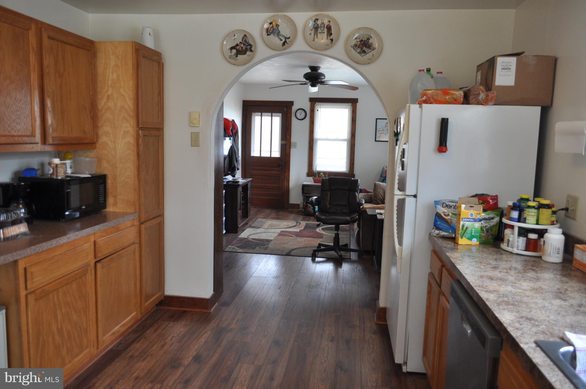 205 East 7th Avenue Ranson, WV 25438 - Photo 16 of 29 a view of living room with furniture and wooden floor