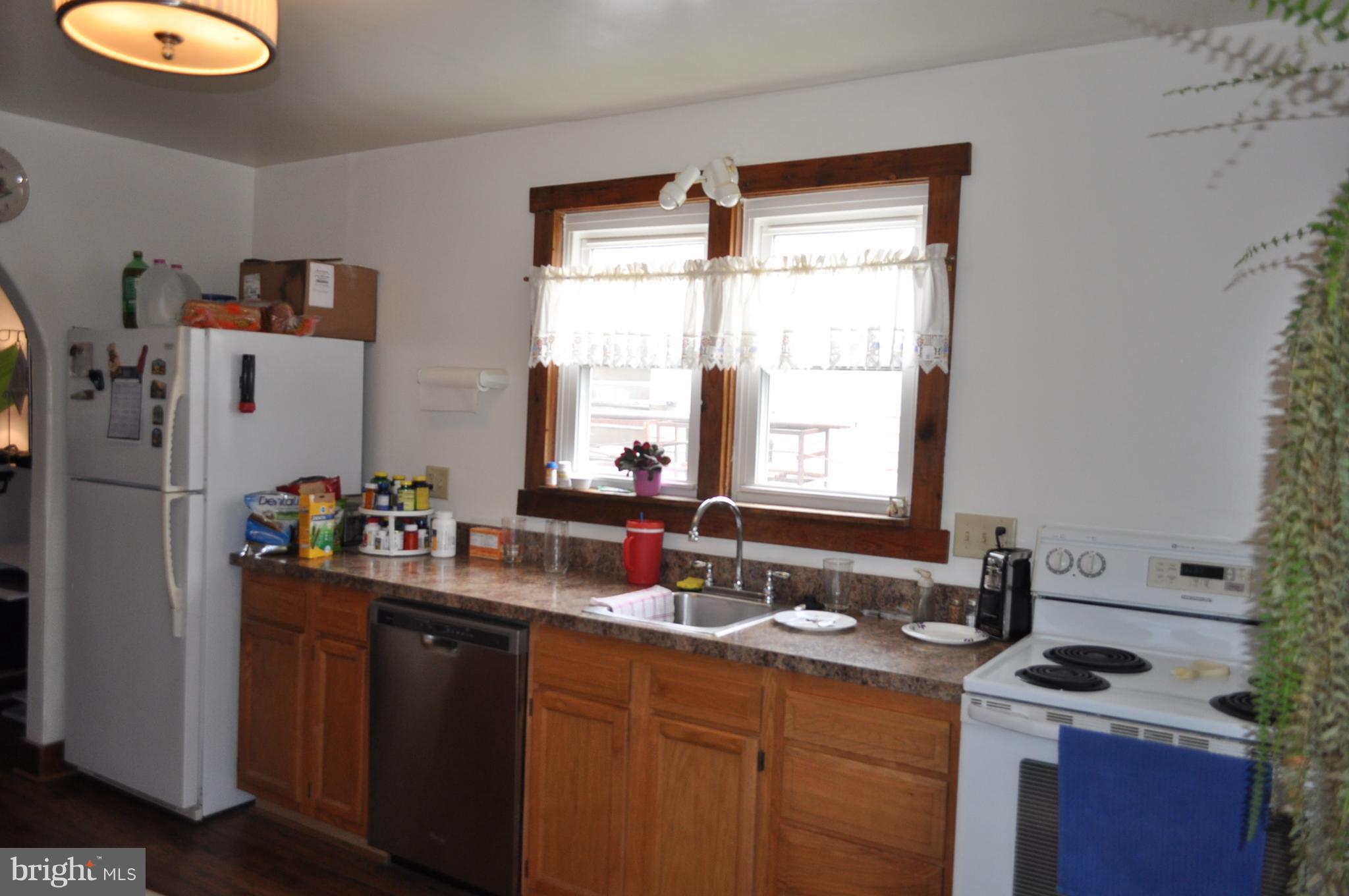 205 East 7th Avenue Ranson, WV 25438 - Photo 17 of 29 a kitchen with a sink cabinets and window